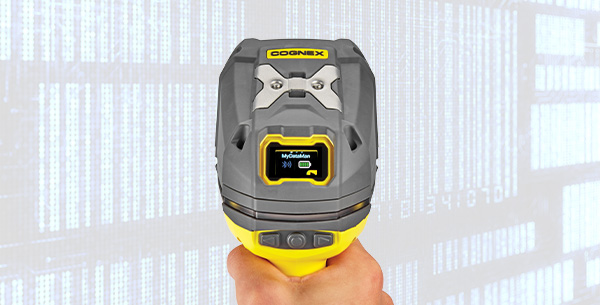 Handheld barcode reader showing data on the screen